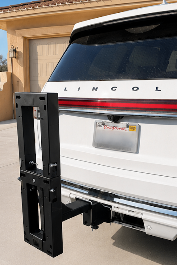 eMotorack carrier folded upright on Lincoln Navigator
